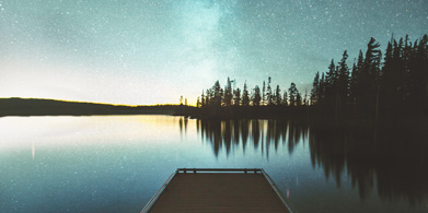 Reflection of night sky on lake photograph